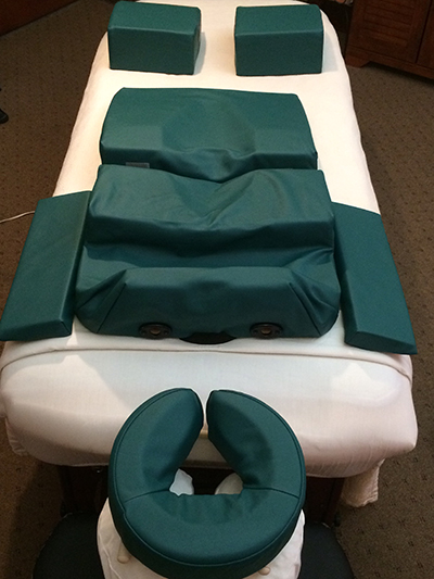 Massage table with cushions